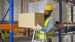 © tampatra - Portrait of black man worker working in large warehouse retail store industry factory. Rack of stock storage. Cargo in ecommerce and logistic concept. Depot. People lifestyle. Shipment service.