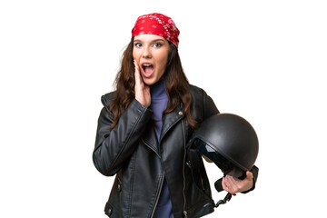 Young caucasian woman with a motorcycle helmet over isolated background with surprise and shocked facial expression