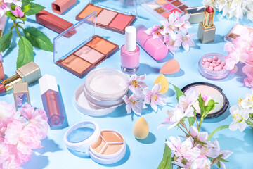 spring make up set on light blue background. different make-up professional cosmetics, beauty access