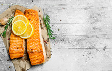 Grilled Salmon Fillet With Slices Of Fresh Lemon.