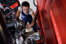 Young Truck Mechanic At Work