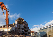 Germany, Bavaria, Munich, Construction Vehicle Demolishing Building