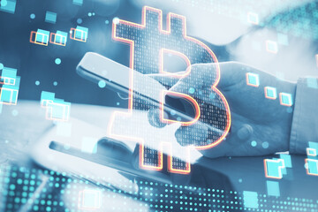 Poster - Close up of hand using cellphone with glowing bitcoin hologram on blurry background. Cryptocurrency, money and finance concept. Double exposure.