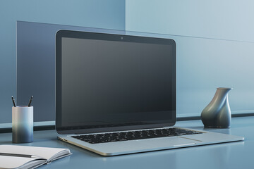 Poster - Close up of empty laptop screen on blue office desktop with supplies and mock up place. Workspace concept. 3D Rendering.