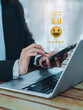 © tete_escape - Customer review, satisfaction, feedback, survey concepts. The User giving 5 stars rating with smile face icon to service experience, business ranking on online application by smart mobile phone.