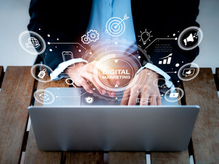 Poster - digital marketing and social media concept. words with strategy icons appear while people using lapt