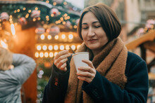 Smiling Woman Having Coffee In Winter