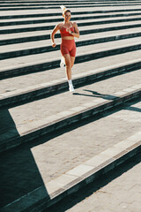 Sticker - Female runner exercising down the stairs outdoors