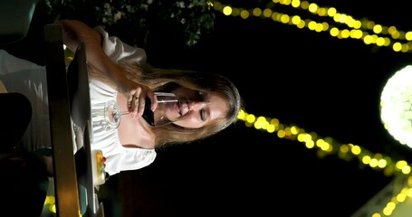 Wall Mural - Woman Enjoying Champagne at Evening Dinner in Luxury Restaurant