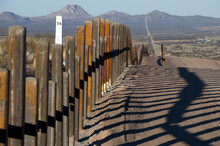The New Post & Rail Border Fence Runs Next To The Original Border Markers, Arizona.