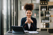 © Nuttapong punna - Young attractive Africa female office worker business suits smiling at camera in office .