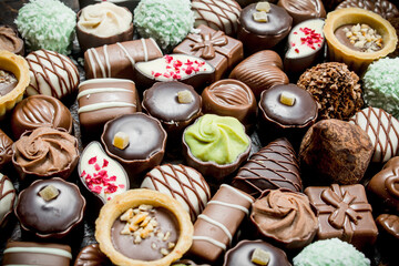 Sticker - Chocolate candies with nuts and various fillings.