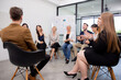 © N_studio - Group of team business people sitting a circle brainstorming and training while leader explaining and presentation at office, seminar and meeting with diversity, business and community concept.