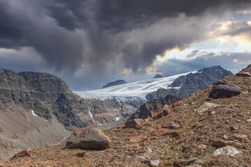 Wall Mural - Gepatschferner at the Italian Austrian border under a dramatic sky, Vallelunga, Alto Adige - Sudtirol, Italy. The glaciers are in rapid retreat caused by global warming