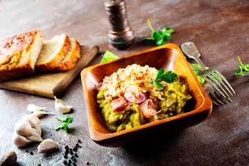 Wall Mural - mashed split peas in a bowl on a gray background