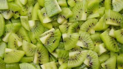 Wall Mural - Chopped kiwi fruit top view. Fresh and healthy food concept