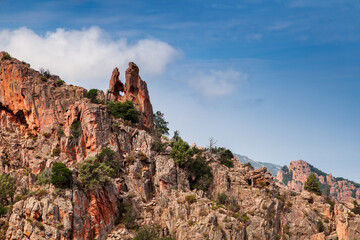 Wall Mural - Rock with a heart shaped hole. Calanques de Piana. Mountain landscape