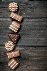 Poster - Chocolate sweets with nuts and various fillings.