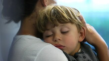 Child Sleeping On Mother Lap Travels By Train Transportation