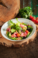 Wall Mural - salad with beef on the wooden background