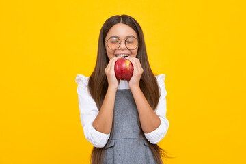 Poster - Portrait of confident teen girl with apple going to have healthy snack. Health, nutrition, dieting and kids vitamins.