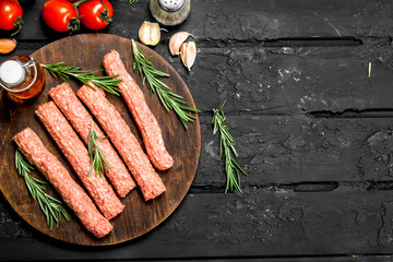 Sticker - Raw sausages with herbs and tomatoes.