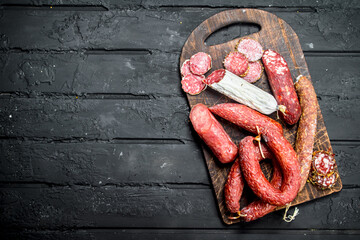 Sticker - Different types of salami with spices and herbs.