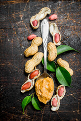 Poster - Peanut butter in a spoon with leaves .