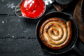 Canvas Print - Fried sausages with tomato sauce.