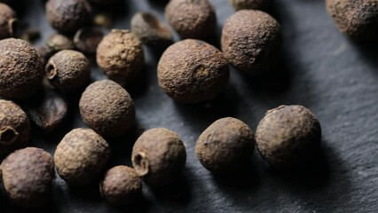 Poster - natural black pepper peas on a stone stand. spicy seasoning