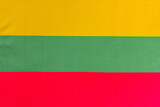 Fototapeta Tęcza - national flag of Lithuania on a fabric basis close-up