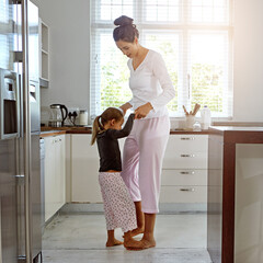 Sticker - Dance, love and mother with girl in kitchen play, fun and bonding, happy and relax in their home. Mom, daughter and dancing in their house, morning and playing while enjoying free day on the weekend