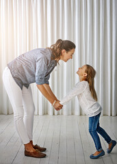 Poster - Happy, family and mom with girl at home holding hands to show love, care and happiness. Lens flare, mother and kid together having fun in a house laughing, playing and holding hand with parent