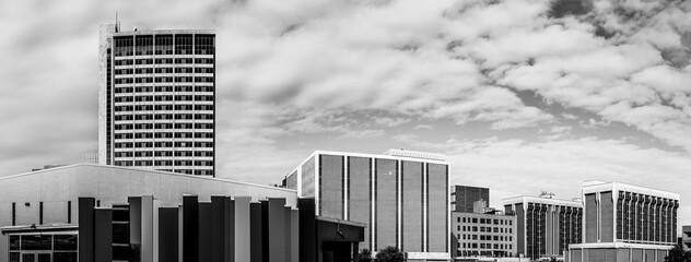 Wall Mural - Panoramic retro-style black and white Modern Midland Texas city skyline and downtown skyscrapers, dramatic cloudscape