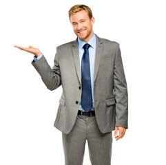A handsome young businessman standing alone in the studio and showing a promotion isolated on a PNG background.