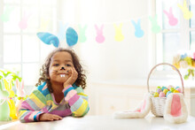 Kids On Easter Egg Hunt. Children Dye Eggs.