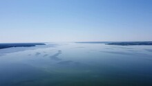 All-round Panorama Over The River From A Drone Height, From A Bird's Eye View. Drone Footage Of The River And Islands On The River. Flight Over The River, An Island In The River.