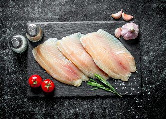 Canvas Print - Fish fillet with garlic,spices and tomatoes.