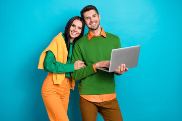 Aufkleber - Photo of positive couple using digital netbook search web buy purchase for valentine day isolated on blue color background