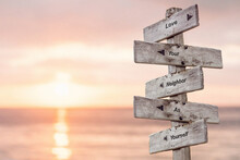 Love Your Neighbour As Yourself Five Word Quote On Wooden Signpost Outdoors With Sunset Background.