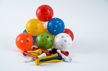 Colored Airflow Indoor Golf Balls With Multi Coloured Wooden Bamboo Tees Isolated On A White Background
