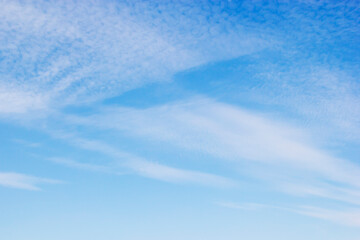 Wall Mural - Fantastic soft white clouds against blue sky and copy space.
