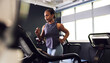 © Flamingo Images - Woman running on a gym treadmill
