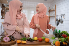 Women Muslim Friends Chef Cook A Healthy Organics Vegetable Foods Cooking Concept.