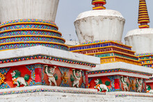 Figures And Painting On A Tibetan Stupa At The Impressive Ta'er Monastery Near Xining, China