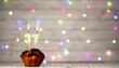 Happy birthday background with muffin and number of candles on light bulbs bokeh background. Greeting card happy birthday copy space with number  37