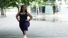 Woman And Sports, Exercise For Weight Loss In The Fresh Air. Happy Curvy Woman Doing Workout Routine Outdoor At City Square