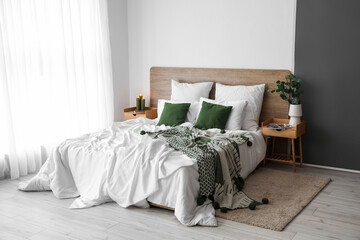 Wall Mural - Interior of light bedroom with wooden tables and big bed