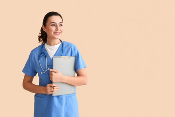 Sticker - Female medical assistant with clipboard on beige background