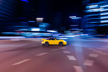Pan Shot Of A  Yellow Porsche